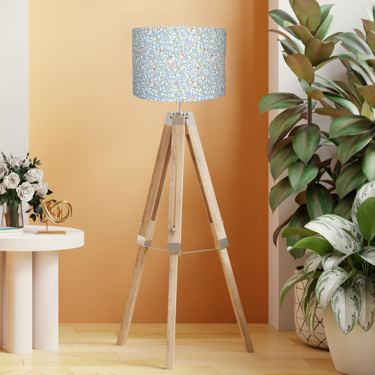 Emotive Collection’s Bird & Pomegranate lampshade on a wooden tripod floor lamp base, featuring colorful bird and pomegranate designs in the iconic William Morris style. Handmade in Australia.