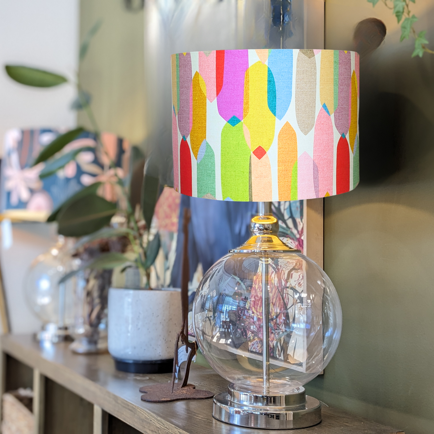 "Bold and vibrant Multi-Colour Mid-Century lampshade by Emotive Collection, shown on a glass lamp base, designed by Australian artist Cecilia Mok. A stunning contemporary piece, handcrafted with love in Australia.