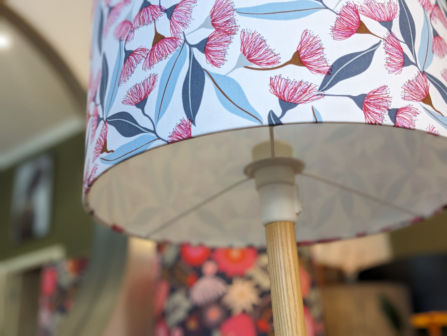 Fitting view of the Gum Blossom design lampshade by Jocelyn Proust, featuring intricate native Australian flora artwork. Handcrafted with care in Australia for a unique lighting piece.
