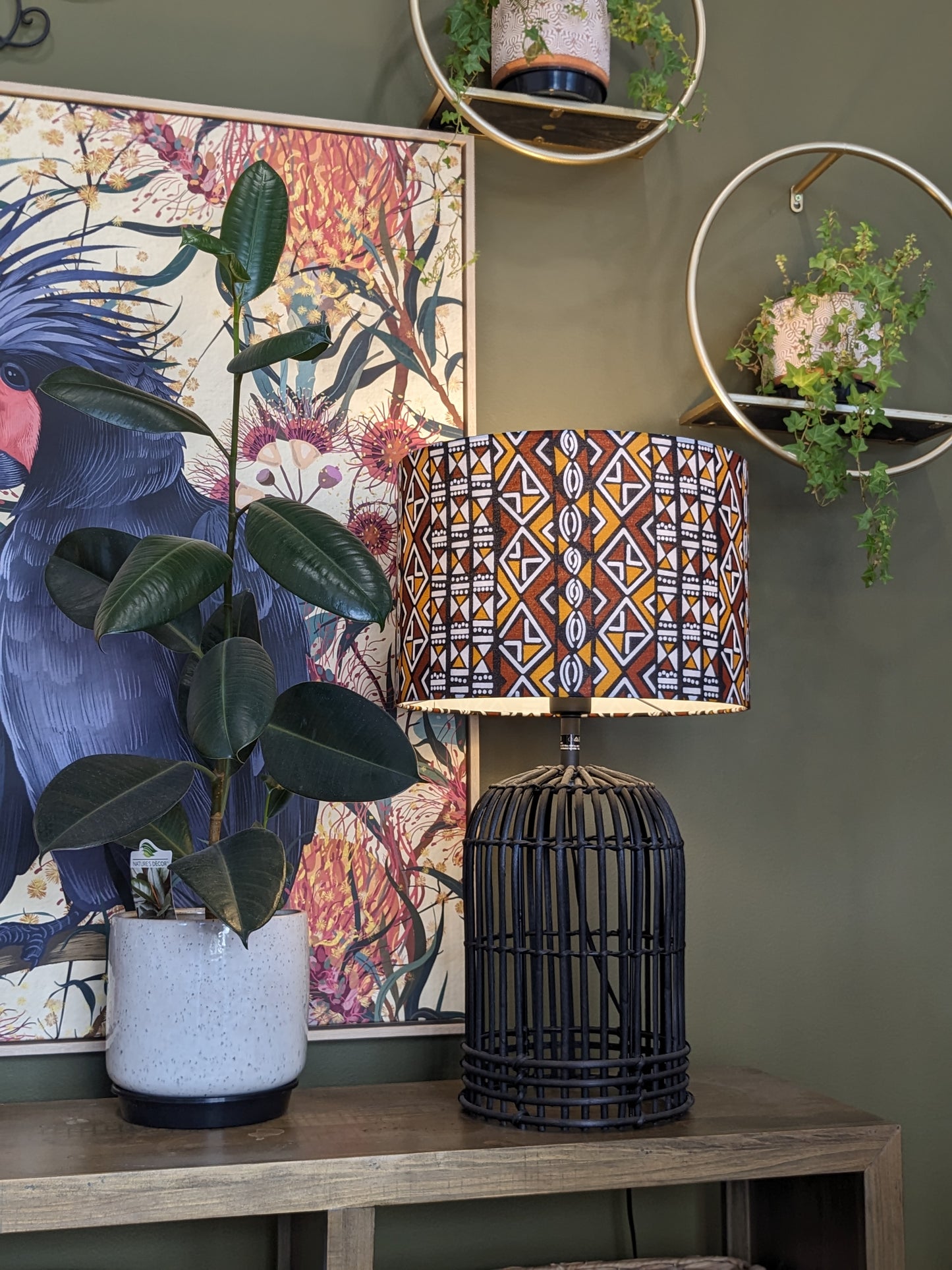 Emotive Collection Handmade African Bogolan lampshade on a rattan lamp base, showcasing rich, traditional African designs on genuine Bogolan mudcloth fabric. Expertly crafted in Australia for a unique, artisan-inspired lighting piece.