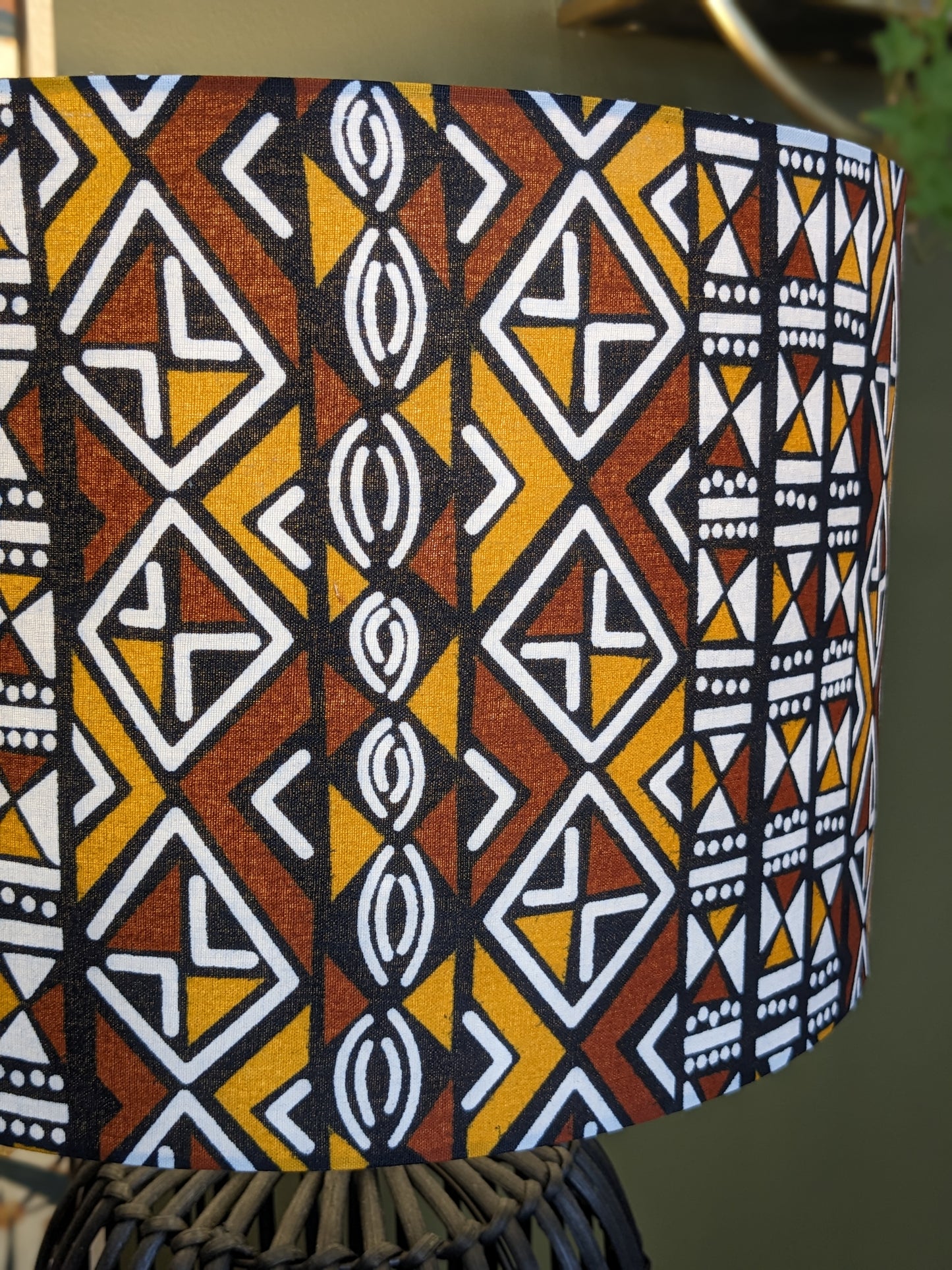 Close up of the handmade African Bogolan lampshade by Emotive Collection, featuring traditional African patterns on authentic Bogolan mudcloth fabric. This cultural masterpiece brings an artisan touch to your home décor. Crafted in Australia.
