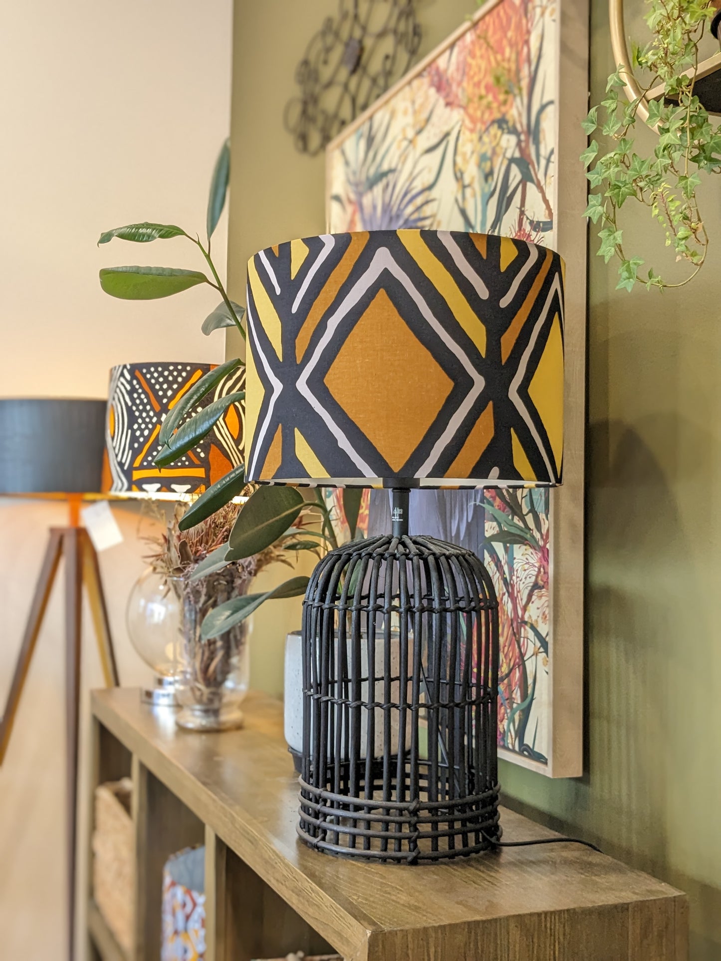 Emotive Collection Handmade Traditional Mali lampshade on a Black wooden base, showcasing unique Malinese prints on Bogolan mudcloth fabric. Expertly crafted in Australia, this lampshade brings ethnic elegance to your décor.