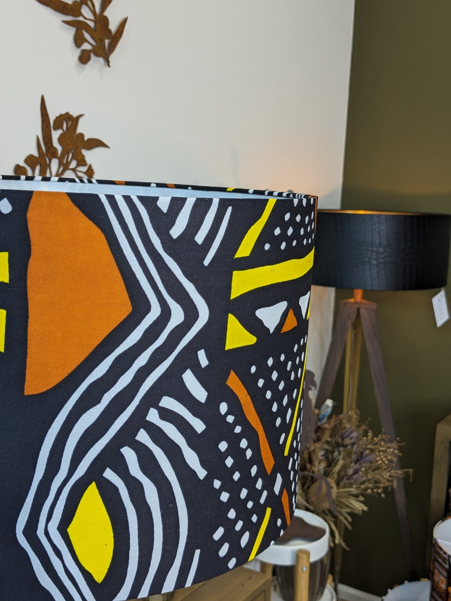 Side view of the Mali African lampshade, showcasing traditional Malinese patterns on rich Bogolan mudcloth fabric. Handcrafted in Australia for a unique cultural touch.