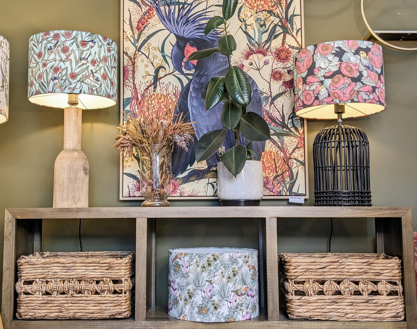 Handmade Rosella & Mallee lampshade by Emotive Collection shown on a sideboard, the lampshade is on a wooden lamp base, showcasing intricate artwork by Australian artist Victoria McGrane from The Scenic Route. Crafted in Australia with attention to detail