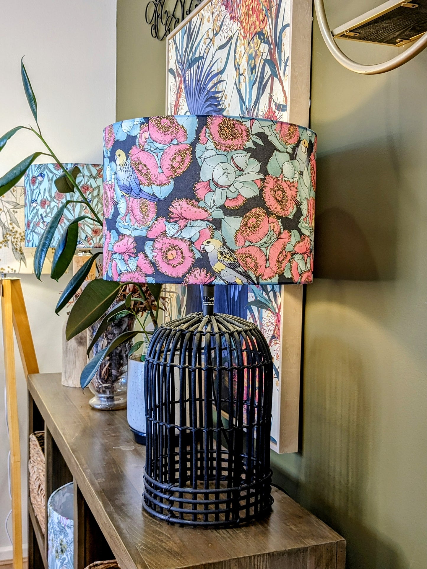 Handmade Rosella & Mallee lampshade on a black lamp base, with a beautiful design by Australian artist Victoria McGrane. A stunning display of nature, crafted in Australia for a distinct artistic touch.