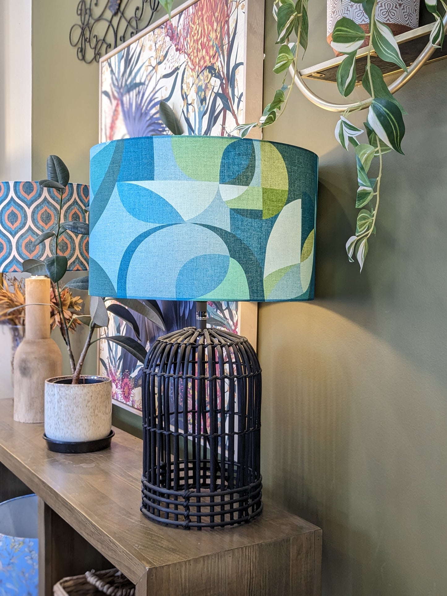 Handmade Modern Circles Teal lampshade by Emotive Collection on a Black lamp base, featuring a vibrant and stylish design by Australian artist Cecilia Mok in striking teal tones. Crafted with precision in Australia.