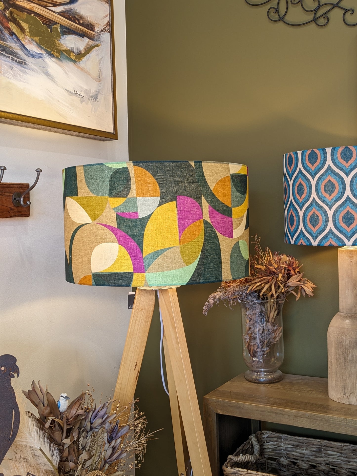 Emotive Collection's Modern Circles lampshade on a wooden tripod floor lamp, designed by Australian artist Cecilia Mok. Made with premium linen fabric, this contemporary piece is handcrafted in Australia to elevate your décor.