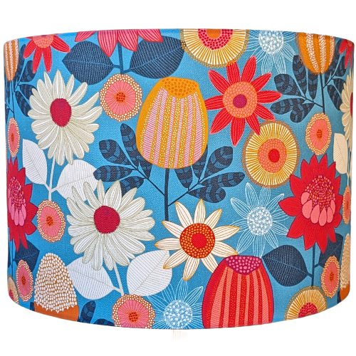 Emotive Collection's Banksia Grove lampshade, designed by Australian artist Jocelyn Proust, featuring Banksia flowers against a Blue background. A perfect blend of nature and artistry, crafted in Australia.