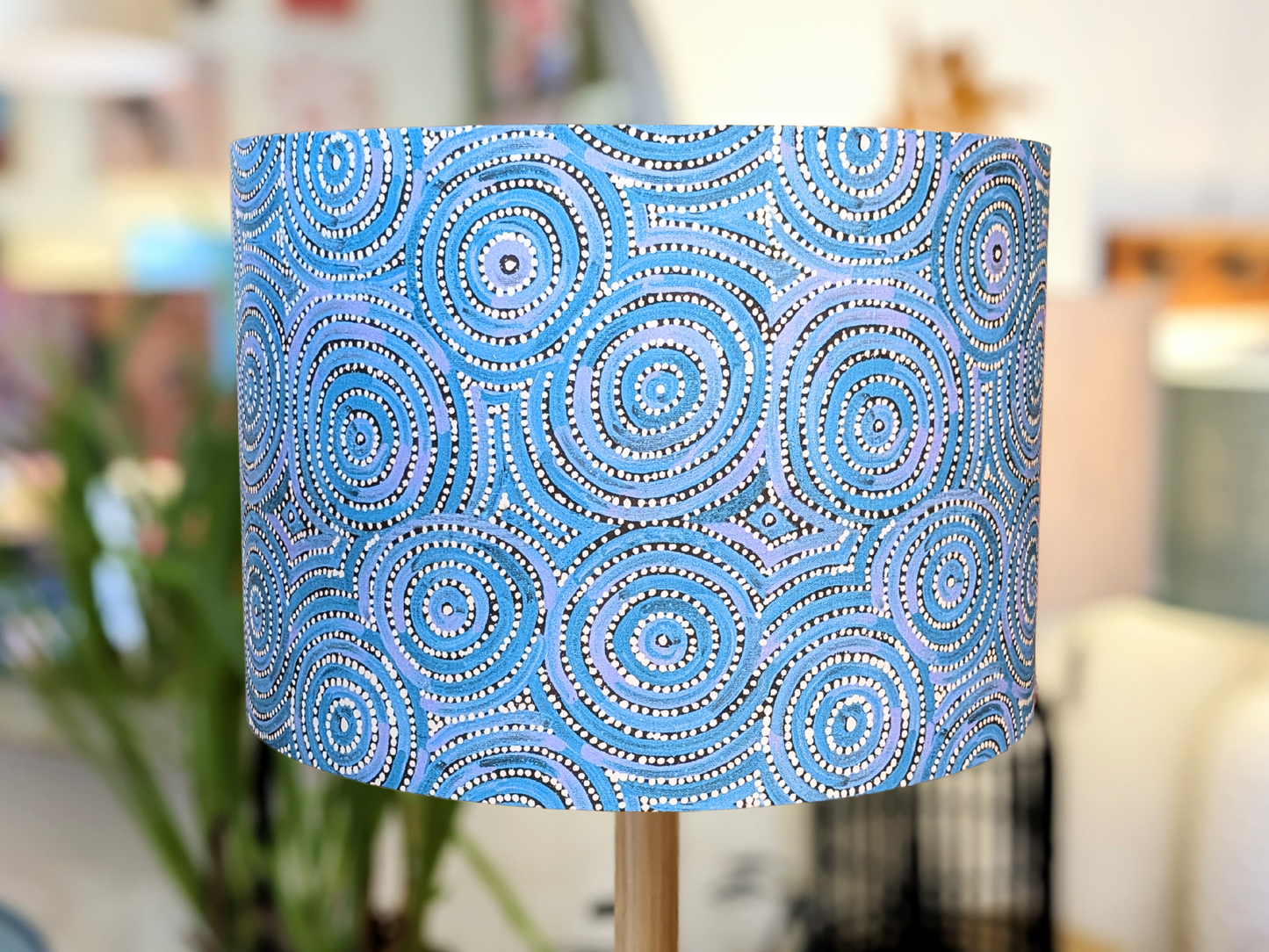 Handmade Aboriginal Aqua Mina Mina lampshade by Emotive Collection, showcasing a traditional design by Warlukurlangu artists. Featuring a blue background, this unique lampshade adds cultural richness to your home décor.