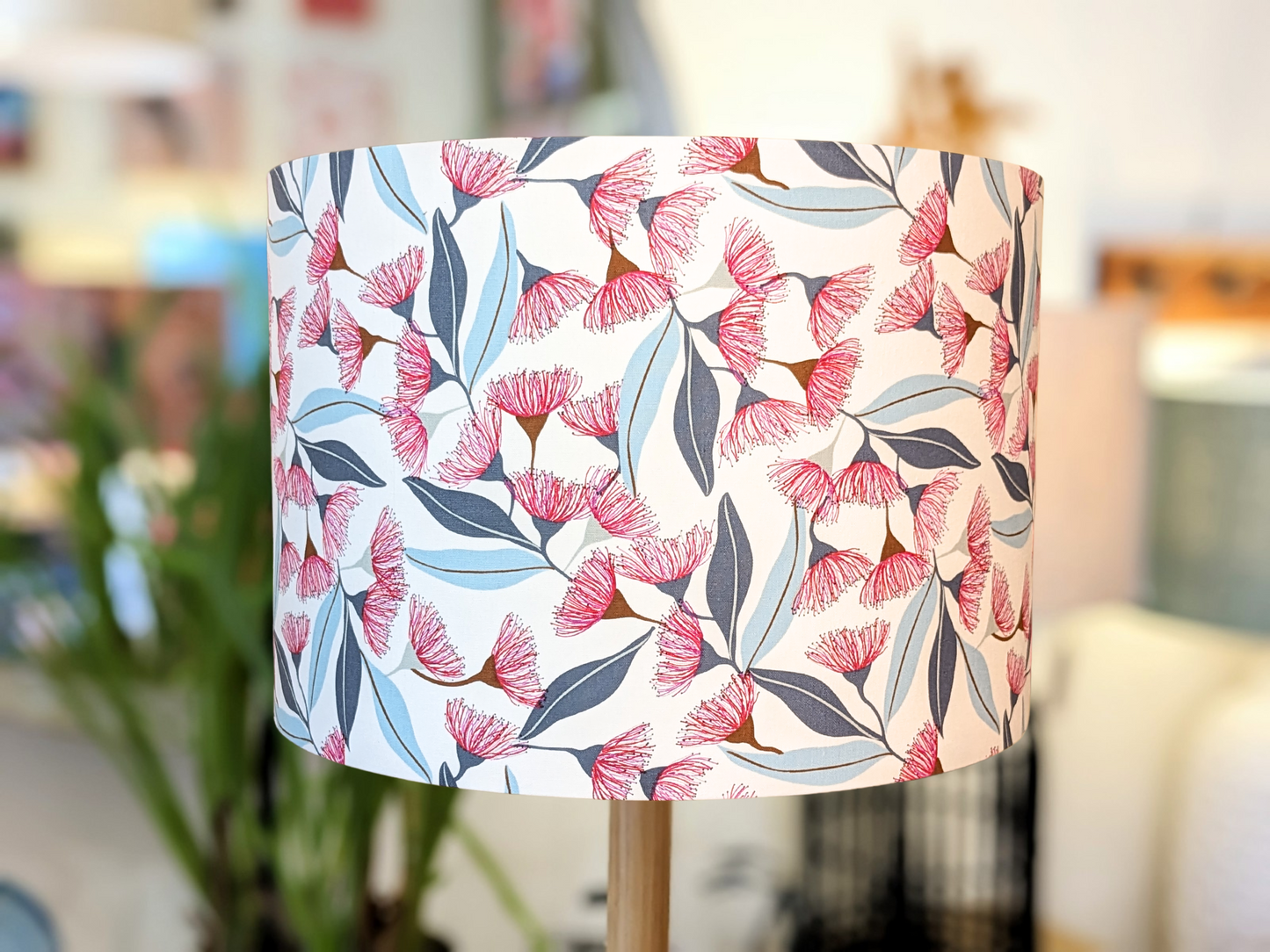 Handmade Gum Blossom design lampshade by Emotive Collection, featuring a stunning artwork by Australian artist Jocelyn Proust. Inspired by native Australian flora, this unique lampshade adds a touch of natural elegance to your home. Crafted with care in A