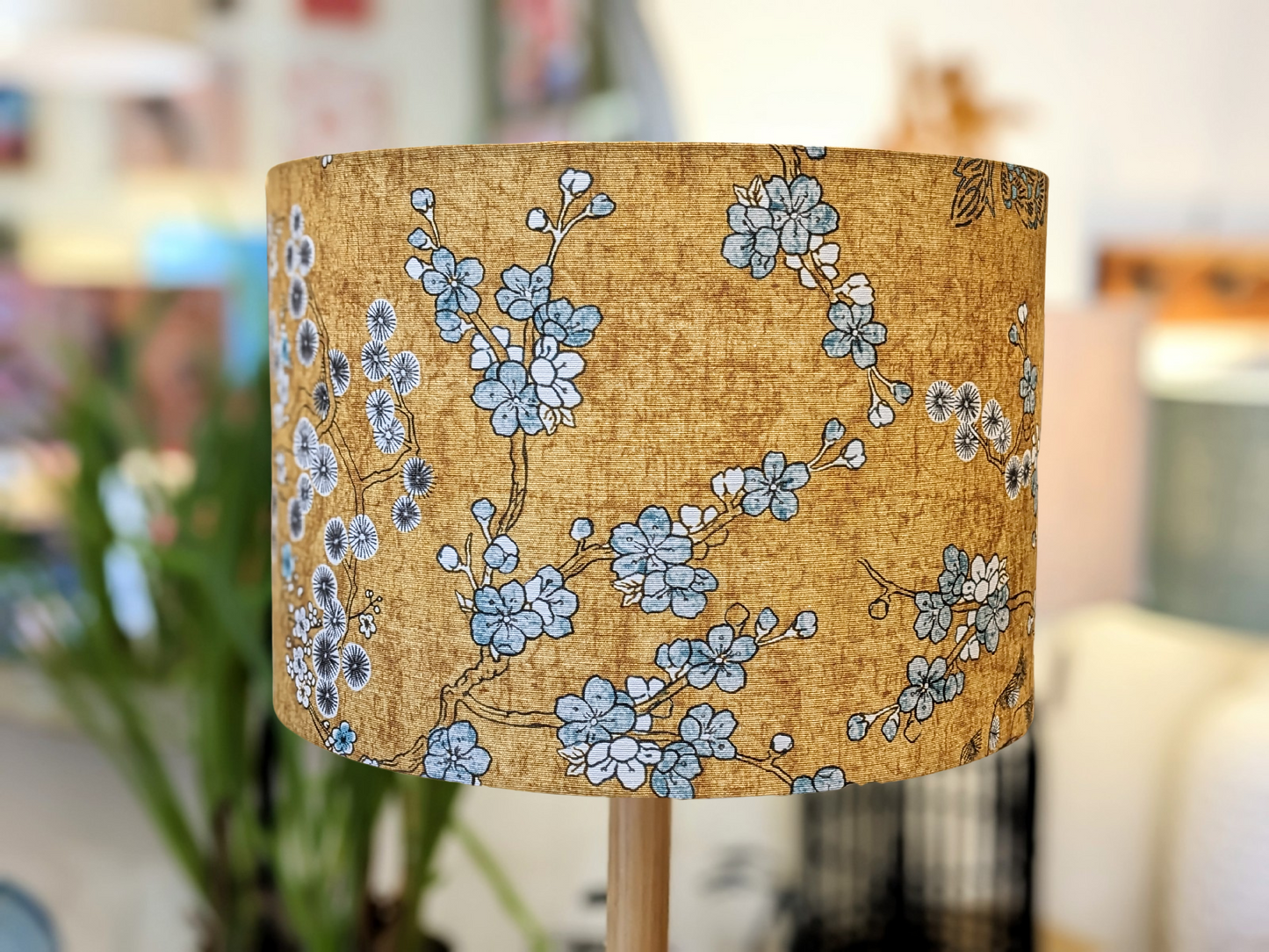 Handmade Japanese Blossom lampshade by Emotive Collection, featuring delicate Japanese blossoms on a mustard yellow background. Crafted in Australia with attention to detail.