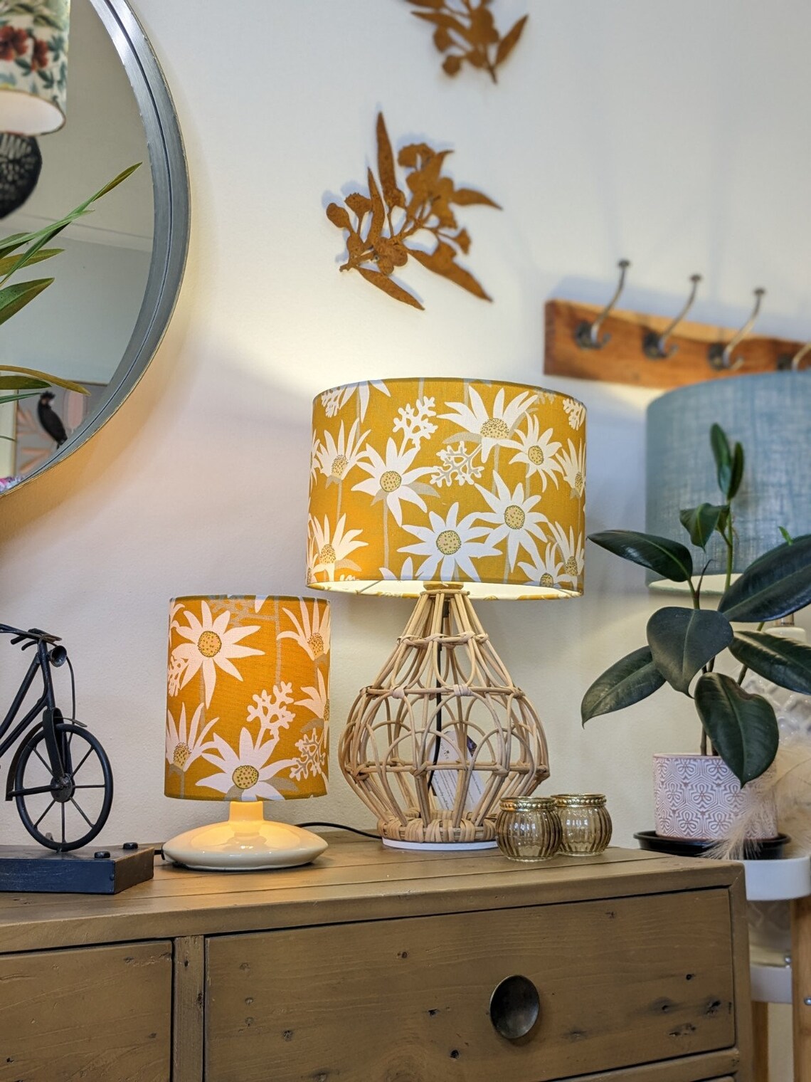 Emotive Collection's Flannel Flower Mustard lampshade on a sideboard, designed by Jocelyn Proust, highlighting intricate flannel flower design in rich mustard hues. Expertly crafted in Australia.