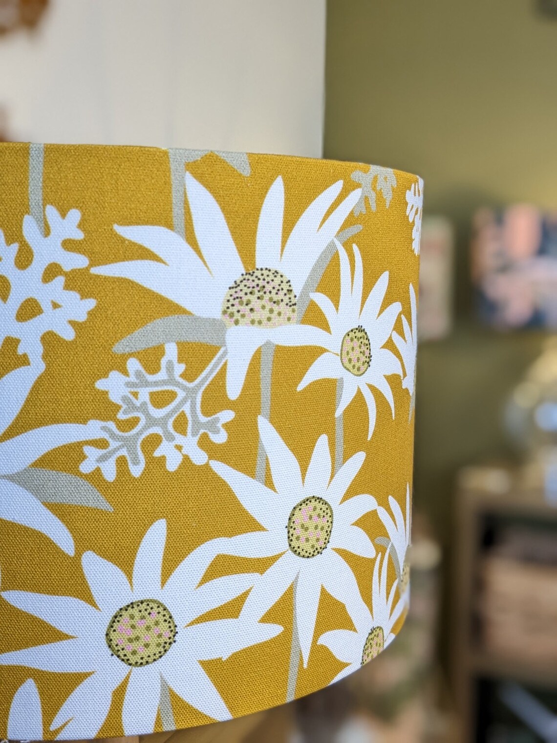 Flannel Flower Mustard lampshade by Australian artist Jocelyn Proust, with a mustard base and detailed flannel flower design. Perfectly crafted in Australia.