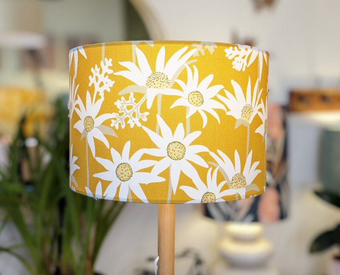 Handmade Flannel Flower Mustard lampshade by Australian artist Jocelyn Proust, featuring delicate flannel flower designs on a warm mustard background. Crafted in Australia.