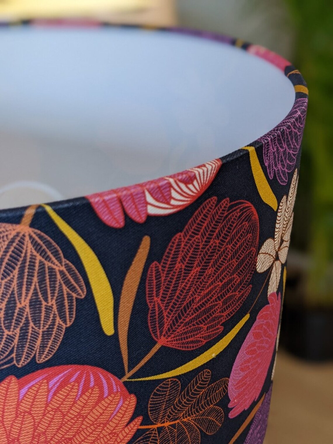 Elegant Midnight Protea lampshade showcasing vibrant protea blooms against a deep, moody background. Handmade with care in Australia.