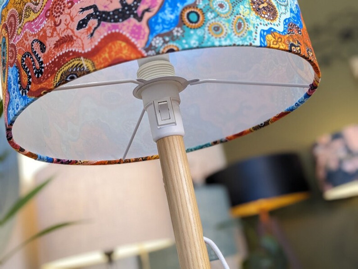 Authentic Aboriginal Outback lampshade with traditional Aboriginal art depicting the Australian landscape. Carefully handcrafted in Australia by Emotive Collection.