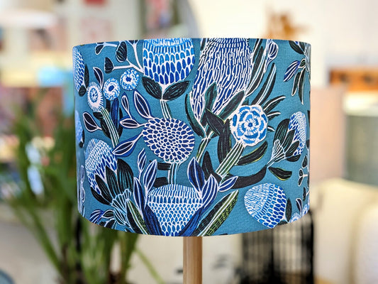 Handmade Banksias Blue lampshade by Emotive Collection, featuring a vibrant design of blue Banksia flowers. Designed by Australian artist Kirsten Katz, crafted in Australia