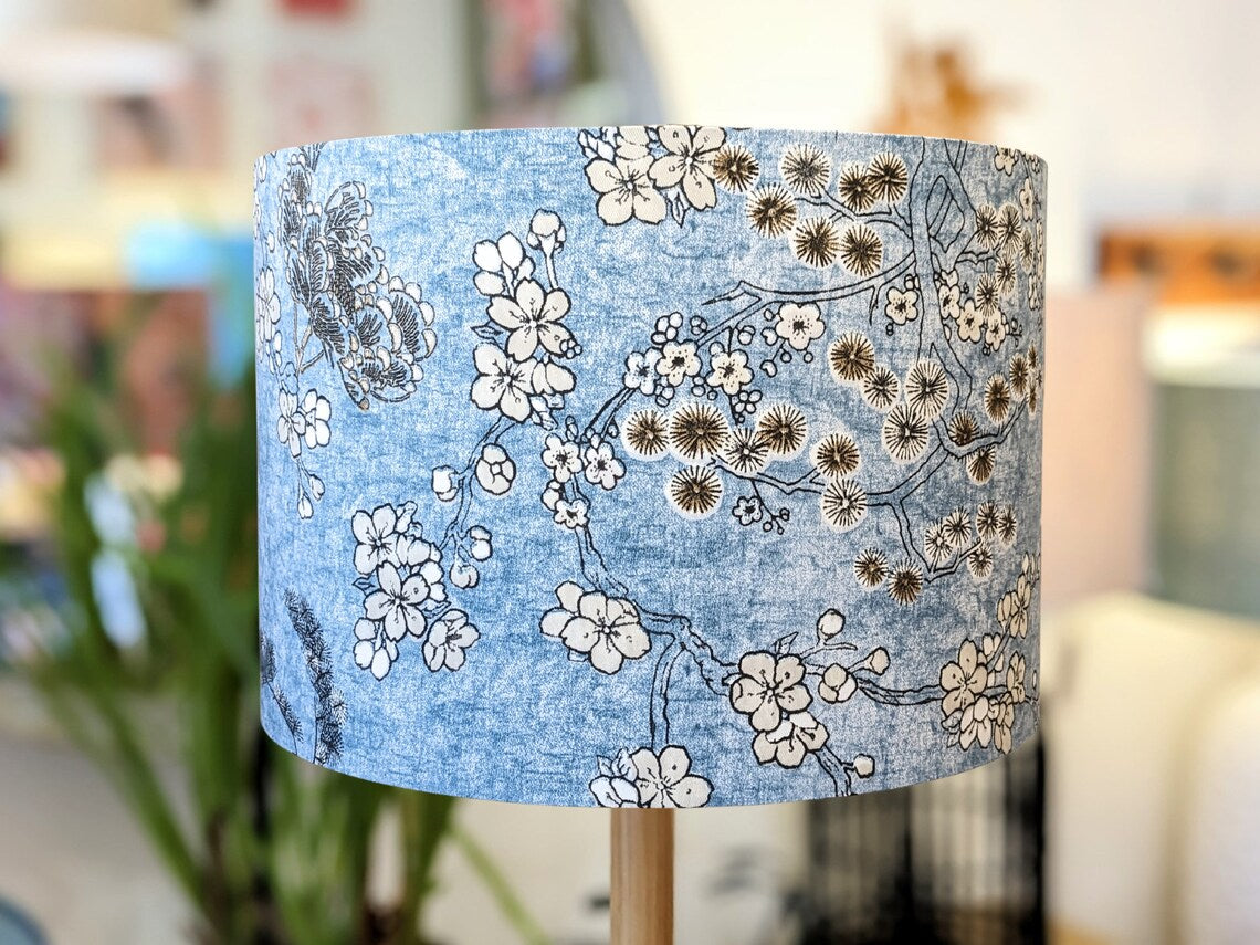 Handmade Japanese Blossom lampshade by Emotive Collection, featuring delicate Japanese blossoms on a calming blue background. Crafted with care in Australia.
