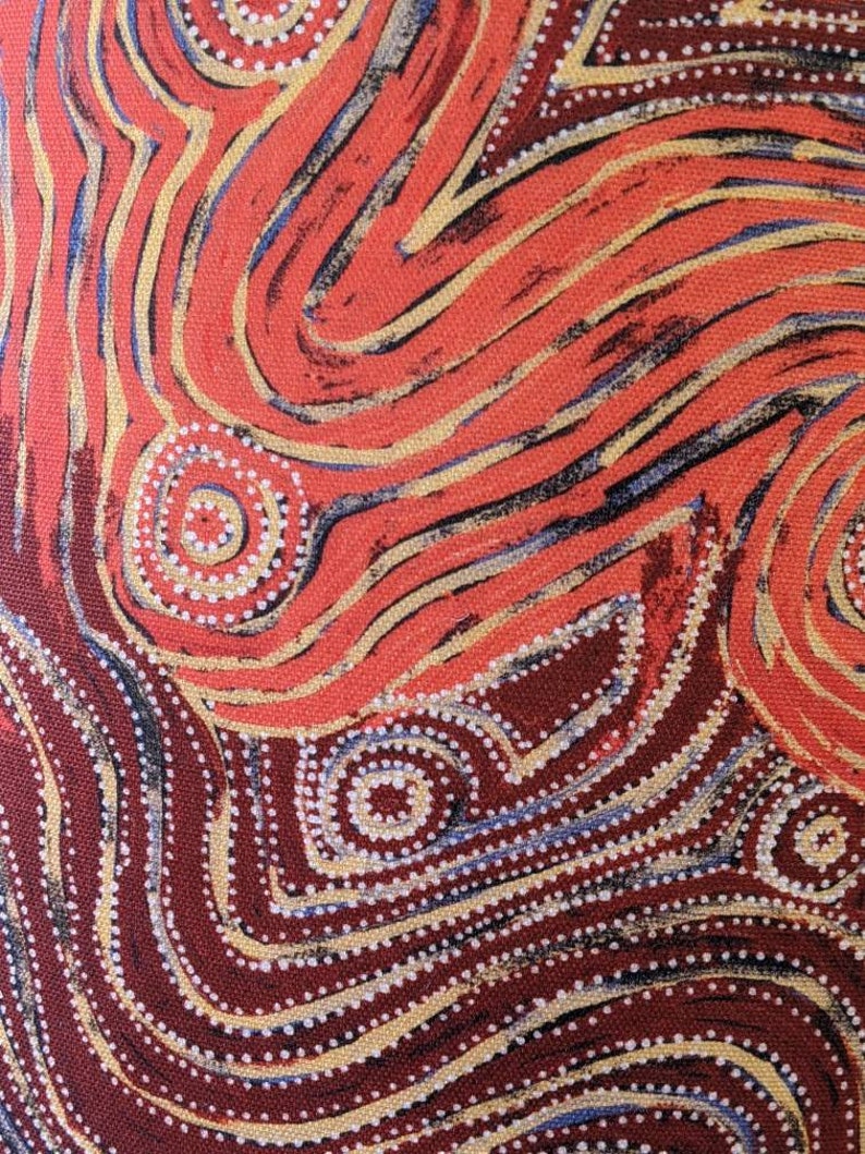 The Indigenous Aboriginal Warlu Mina Mina Dreaming Lampshade by artist Pauline Napangardi Gallagher features abstract red, orange, and yellow swirling lines, with white and pale blue dotted circles on a brown background.