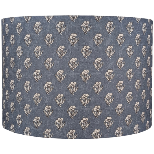 The Aanya Indian Block Print Lampshade by 100% Premium Linen is a cylindrical, blue linen shade featuring beige stylized leaf motifs, inspired by Indian block prints and expertly crafted in Australia.
