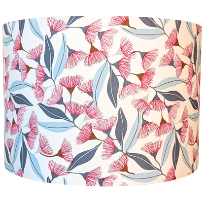 Floral patterned lampshade with pink flowers and blue leaves on a white background