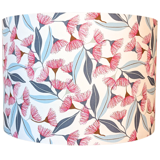 Floral patterned lampshade with pink flowers and blue leaves on a white background