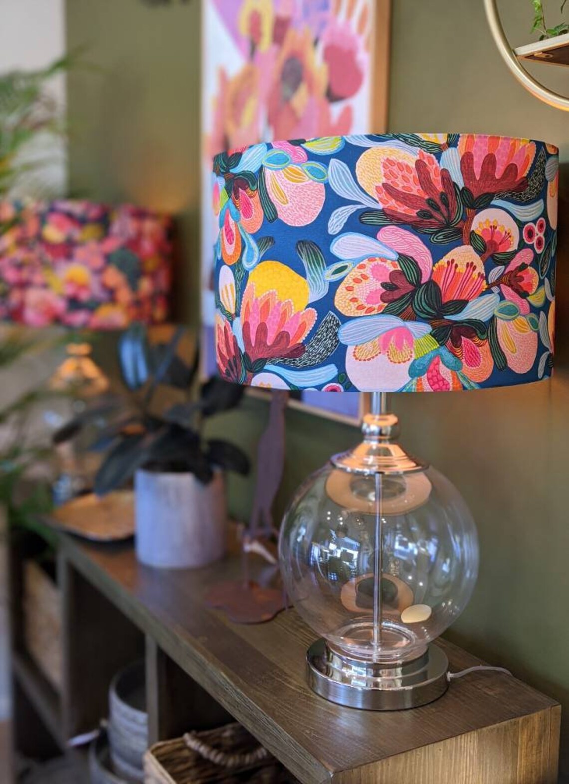 Handmade Midnight Bush lampshade by Emotive Collection on a glass lamp base, featuring a beautiful design by Australian artist Kirsten Katz inspired by native Australian flora. Crafted with care in Australia for an artistic lighting statement.